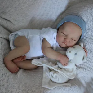 Lifelike 19 inch reborn baby Levi sleeping in white romper with a small teddy bear
