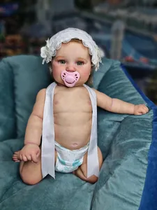Detailed view of realistic Maddie reborn doll with lace headband and heart pacifier