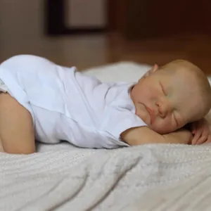 Lifelike 19 inch reborn baby doll Levi with 3D skin sleeping in white bodysuit