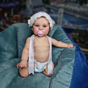 Lifelike 50cm Maddie Reborn baby doll with lace hat, pacifier, and realistic skin texture