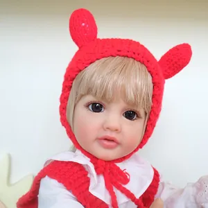 55cm realistic baby doll wearing a red knitted bunny ear hat and matching vest set