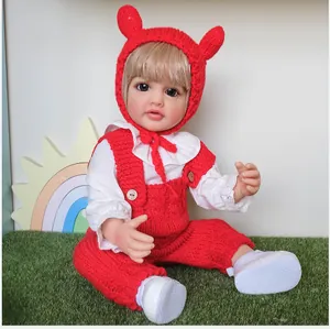 Lifelike 55cm Betty reborn doll in a red knit romper with a bear ear hat and lace shirt
