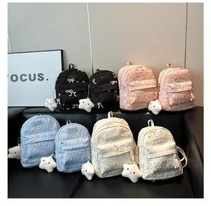 Mini sacs à dos matelassés en quatre couleurs avec breloques étoiles et nœuds