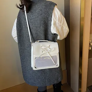 Stylish white PU leather backpack for women featuring a decorative bow and mesh window