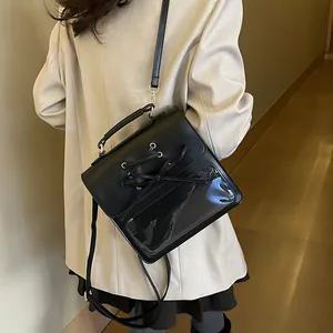 Women's black PU leather crossbody bag with clear window and bow detail for casual style