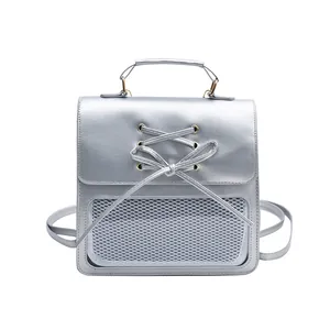 Chic silver metallic backpack for women with cross-lace bow detail and mesh window