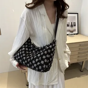 Chic black and white checkered tweed tote bag for women with fringe details
