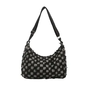Retro black checkerboard canvas tote bag with frayed edges and adjustable strap