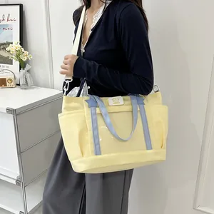 Pale yellow Japanese style crossbody tote bag with blue star accents and fashion tag
