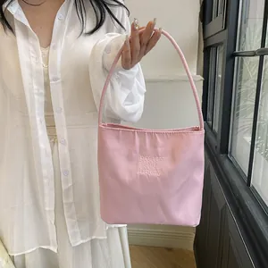 Pink casual shoulder bucket bag with embroidered lettering and matching straps