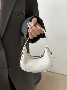 Detail of white lychee pattern mini hobo bag with gold zipper and metal hardware