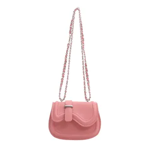Pink minimalist saddle bag for women with wavy edge and silver chain shoulder strap