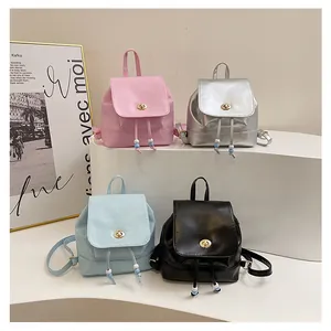 Mini PU leather backpacks in pink, silver, blue, and black with metallic twist locks
