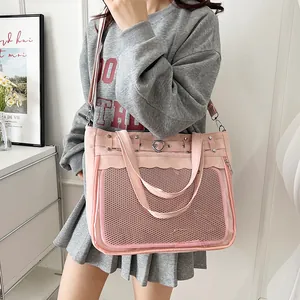Pink canvas ita bag with a clear window and heart buckle for anime badge display