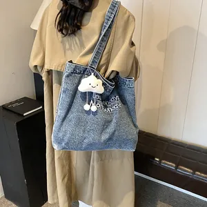 Blue denim tote bag with Less Mondays More Sundays embroidery and cloud charm