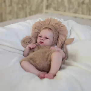 Realistic 49cm Elijah reborn baby doll in brown lion knit outfit with matching toy