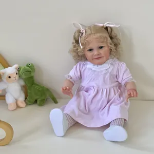 Lifelike 55cm reborn baby doll Zoe in pink lace dress with blonde hair and soft plush toys