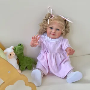 Lifelike 55cm Reborn baby doll Zoe with curly blonde hair in a pink lace dress