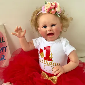 Realistic 60cm reborn baby doll with blonde curls and 1st birthday party outfit