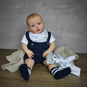 60cm realistic handmade Sandie reborn doll in blue overalls with a teddy bear toy