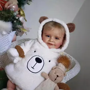 Plush white hooded baby romper with bear ears and matching brown knitted teddy bear