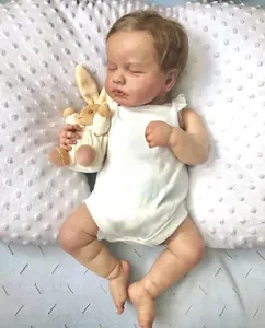 Macro shot of 49cm reborn baby doll sleeping with 3D skin and visible veins detail