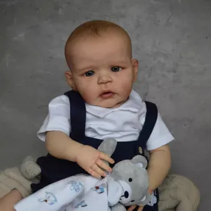 Lifelike 60cm Sandie reborn baby doll wearing polo shirt and overalls with bear comforter