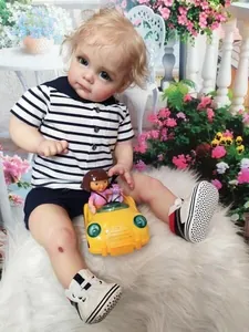 Detailed close-up showing the realistic 3D painted skin and blue eyes of the reborn baby boy
