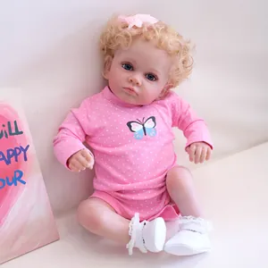 Poupée bébé reborn réaliste 60cm avec boucles blondes et body rose à pois