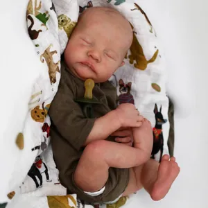 Realistic 49cm reborn baby Levi doll sleeping in green romper and cartoon swaddle blanket