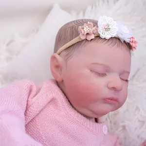 Bambola reborn realistica da 19 pollici con cardigan rosa e fascia per capelli a fiori