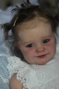 Close-up of lifelike Reborn Doll facial details with realistic skin and blue eyes