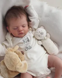 Detail of white long sleeve reborn baby onesie with dream BIG little ONE print
