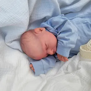 Lifelike 19-inch Reborn baby doll Miley in sleeping pose with blue knitted outfit