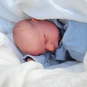 Realistic 19-inch sleeping reborn baby doll Miley in blue outfit with white blanket