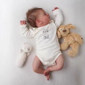 Realistic 18-inch newborn reborn doll Sam in white jumpsuit with plush toys