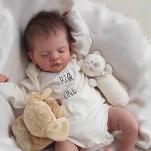 Realistic 18-inch sleeping newborn reborn baby doll in white cotton bodysuit with soft toys