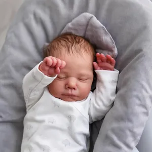 Realistic 19 inch sleeping reborn baby doll with rooted hair in a white sheep romper