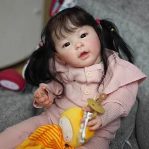 60cm realistic reborn baby doll with long black pigtails in pink ribbed romper and bee plush