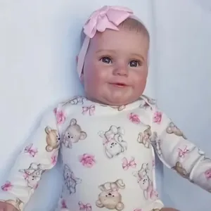 Lifelike 50/60cm Reborn Baby Doll Maddie in teddy bear onesie with pink bow headband