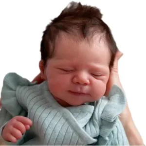 Lifelike 19 inch reborn baby doll in mint green romper sleeping peacefully