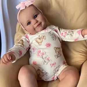 Lifelike 50/60cm Reborn Baby Doll Maddie wearing pink bow headband and floral romper