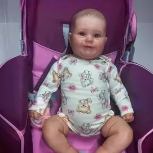 Lifelike 60cm Reborn Baby Doll Maddie wearing floral bear romper in a purple stroller