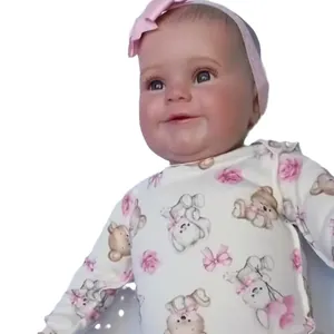 50cm lifelike Maddie reborn baby doll in teddy bear outfit with pink bow headband