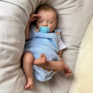 Lifelike 48cm reborn baby doll sleeping in blue knit romper with magnetic pacifier