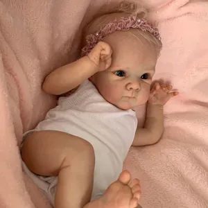 Détail de poupée Reborn 18 pouces avec cheveux blonds, bandeau rose et barboteuse