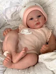 Close-up of 48cm handmade reborn doll with realistic 3D skin and pink lace outfit
