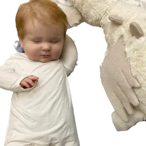 Realistic 60cm Joseph reborn baby doll with visible veins wearing a white onesie