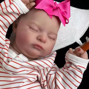Lifelike 20-inch sleeping reborn baby doll with 3D skin texture and red striped outfit