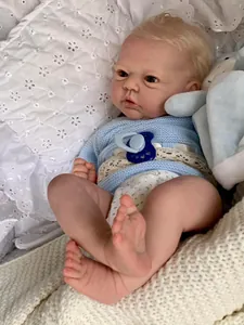 Close-up of a 19-inch reborn baby doll showing realistic skin veins and blue knit outfit